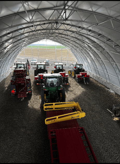 Storage unit for hay with tractors in it